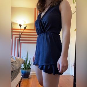 Royal blue ribbed romper, deep v-neck. 95% polyester, 5% spandex.